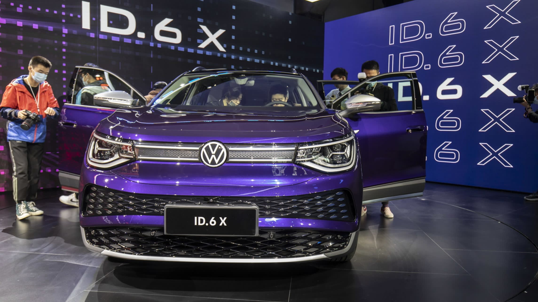 People look at a Volkswagen car in Shanghai, China