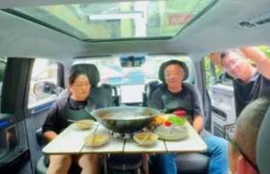 China auto company VP faces backlash after clip shows him eating hotpot in car China auto company VP faces backlash after clip shows him eating hotpot in car