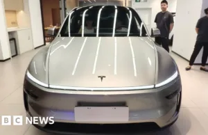 Tesla earnings slide despite record revenue Tesla earnings slide despite record revenue