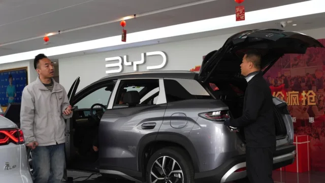 China's BYD sees first profit drop since 2021, even as the Tesla-rival takes global EV crown